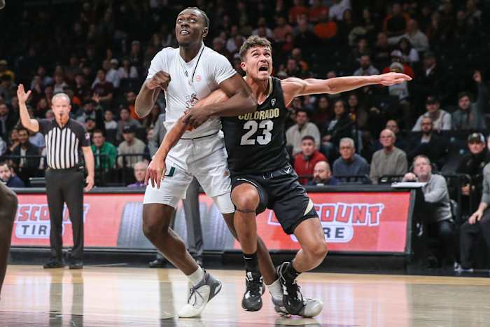 Dec 10, 2023; Brooklyn, New York, USA; Miami (Fl) Hurricanes center Michael Nwoko (1) and Colorado Buffaloes forward Tristan da Silva (23) box out for a rebound in the first half at Barclays Center